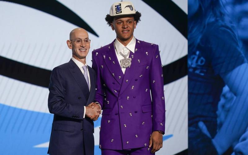 Paolo Banchero, right, poses for a photo with NBA Commissioner Adam Silver after being selected as the number one pick overall by the Orlando Magic in the NBA draft on Thursday in New York. (JOHN MINCHILLO/Associated Press)