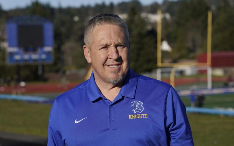 Joe Kennedy, a former assistant football coach at Bremerton High School in Bremerton, Wash., poses for a photo March 9, 2022, at the school's football field. (TED S. WARREN/AP File)
