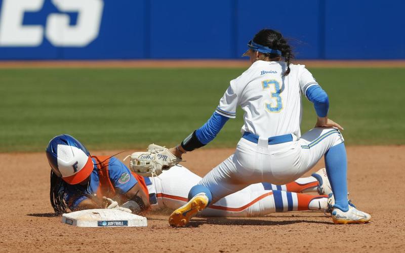 Florida outfielder Cheyenne Lindsey slides in safe at second base before UCLA infielder Briana Perez can make the tag during the fifth inning of Sunday’s Women's College World Series game in Oklahoma City. (AP Photo/Alonzo Adams)