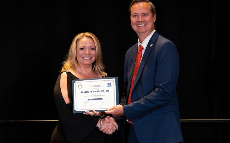 Citrus County Clerk Angela Vick presents Clerk Jay Swisher with his certification as a Florida Clerk and Comptroller. (COURTESY)