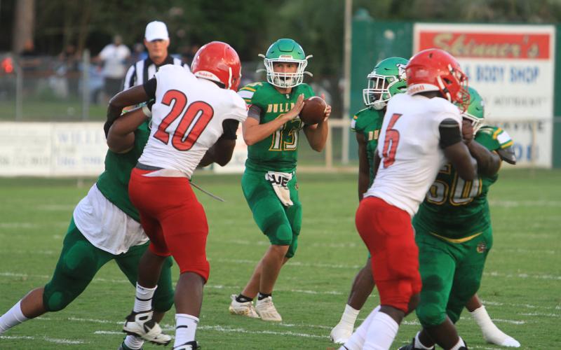 Suwannee quarterback Bronsen Tillotson drops back to pass against Hamilton County in the Preseason Classic on Aug. 20, 2021. The teams will face each other in the regular season this year on Sept. 2 in Jasper. (FILE)