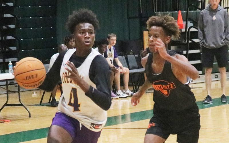 Columbia forward Ty’jahn Wright drives to the basket against Orange Park during summer league play on Thursday at FGC. (JORDAN KROEGER/Lake City Reporter)