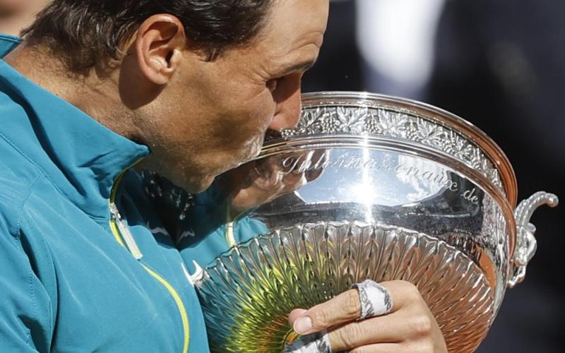 Rafael Nadal kisses the cup after defeating Casper Ruud in their final match of the French Open at the Roland Garros Stadium on Sunday in Paris. Nadal won 6-3, 6-3, 6-0. (JEAN-FRANCOIS BADIAS/Associated Press)