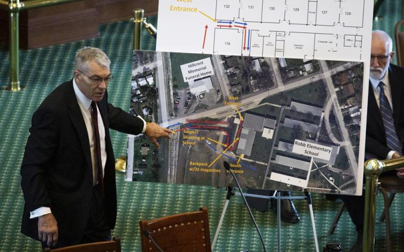 Texas Department of Public Safety Director Steve McCraw uses maps and graphics to present a timeline of the school shooting at Robb Elementary School in Uvalde, during a hearing Tuesday in Austin, Texas. Two teachers and 19 students were killed. (SARA DIGGINS/Austin American-Statesman via AP)
