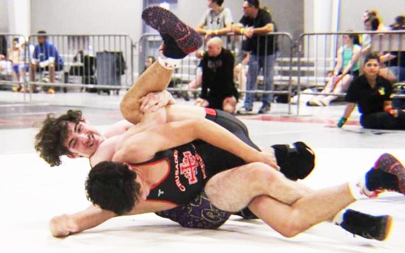 Columbia’s Alex Ulloa puts a Brother Martin wrestler in a spladle during the Jazz Town Duals this past weekend. (COURTESY)