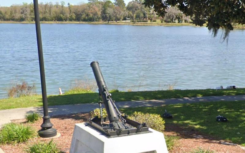 A World War I trench mortar sits on the banks of Lake DeSoto as a memorial to all who fought in the war. (COURTESY)