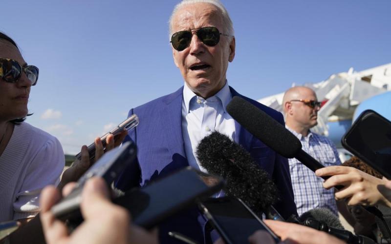 President Joe Biden speaks to members of the media after exiting Air Force One on July 20 at Andrews Air Force Base, Md. (AP FILE)