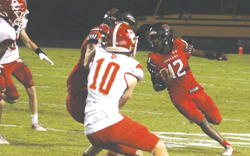 Fort White receiver Najeeb Smith makes a cut during a game against Dixie County on Oct. 15, 2021, at Arrowhead Stadium. (FILE)