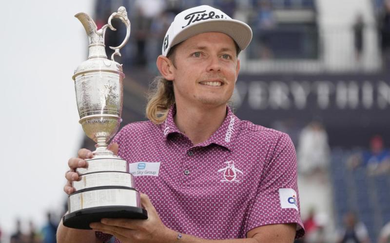 Cameron Smith holds the claret jug trophy as he poses for photographers on the 18th green after winning the British Open on the Old Course at St. Andrews on Sunday in Scotland. (GERALD HERBERT/Associated Press)
