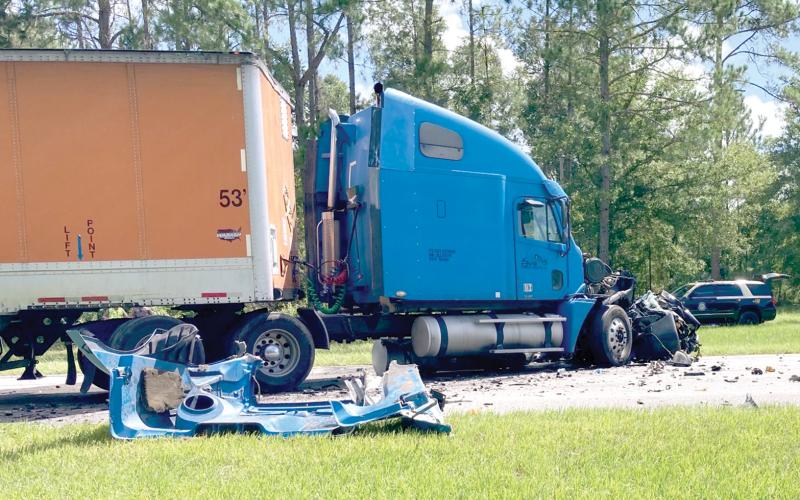 A speeding car ran head-first into a tractor trailer just north of High Springs on Wednesday morning. The car’s driver was killed. (COURTESY/FLORIDA HIGHWAY PATROL)