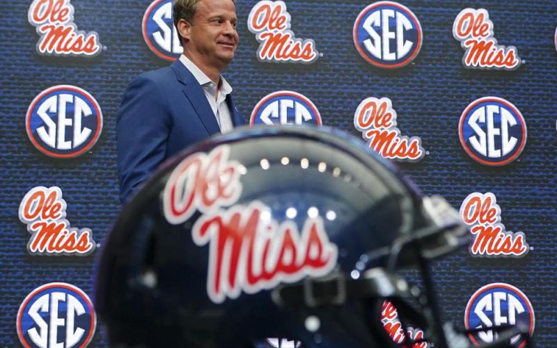 Mississippi head coach Lane Kiffin walks to the podium before speaking during SEC Media Days on Monday in Atlanta. (JOHN BAZEMORE/Associated Press)