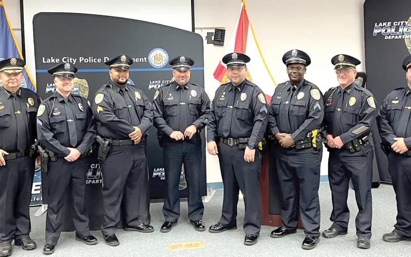 Lake City Police Chief Gerald Butler (left) promoted five officers in a ceremony Tuesday. Those promoted include (from left) Cpl. Gary Borchardt, Sgt. Michael Del Castillo, Cpl. Tim Parisi, Cpl. Brandon Rose and Cpl. LaQuinta Lovick-Plemmons. Also pictured are Assistant Chief Andy Miles (Second from right) and Lt. Garrett Register (right). (COURTESY)