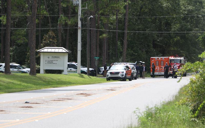 First responders congregate on the Florida Gateway College campus Wednesday afternoon after a bomb threat was called in against the school. (MORGAN MCMULLEN/Lake City Reporter)
