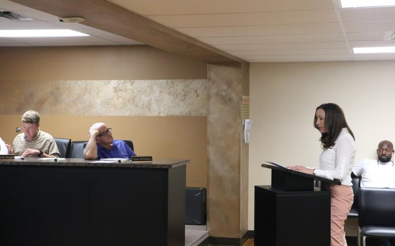 Dr. Molly White (right) gives her presentation to the LSHA board during Wednesday's meeting. (MORGAN MCMULLEN/Lake City Reporter)