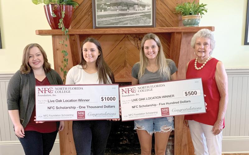 Suwannee High graduates Teresa Williams (second from left) and Madison Ramsey (second from right) were awarded scholarships from the NFC Foundation after an open house event at North Florida College’s Live Oak Learning Center. Williams was drawn as the $1,000 scholarship winner while Ramsey was selected for a $500 scholarship. Joining the two winners are NFC Foundation Scholarship Coordinator Annabelle Scott (left) and Myra Brock, NFC Foundation Board of Directors member. (COURTESY)
