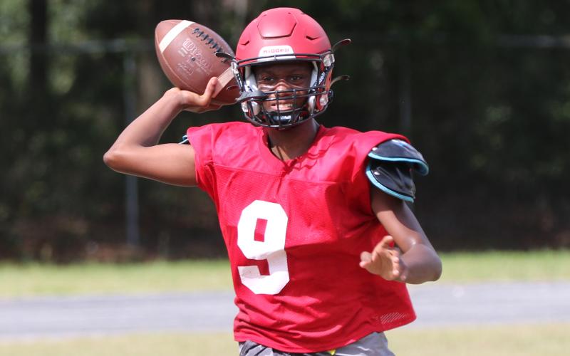 Lafayette quarterback Tywan Williamson throws a pass during practice on Aug. 3. (JAMIE WACHTER/Lake City Reporter)