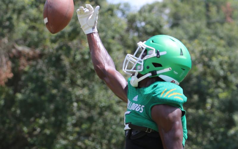 Suwannee defensive back Jay Smith knocks the ball away during a drill at practice on Aug. 4. (JAMIE WACHTER/Lake City Reporter)