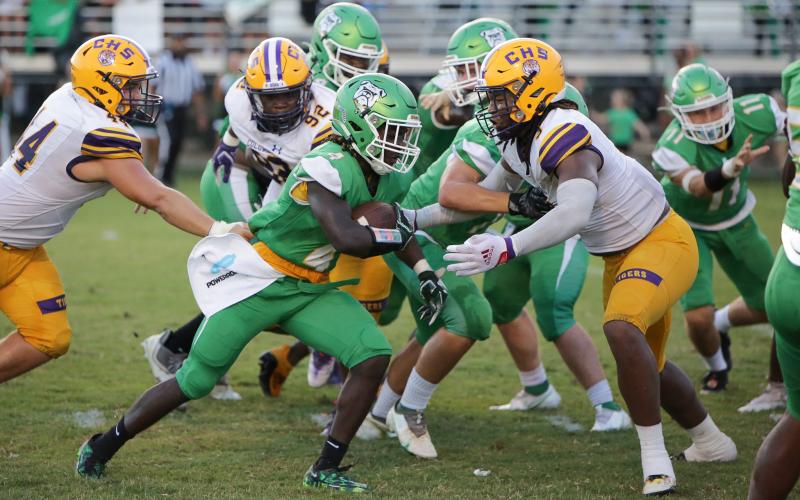 Columbia High defensive lineman Rashod Bradley closes in on Suwannee High running back Marquavious Owens during the Preseason Classic on Aug. 19. (BRENT KUYKENDALL/Lake City Reporter)
