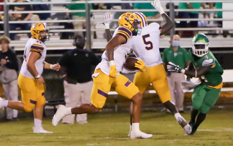Columbia safety Amare Ferrell returns an interception 97 yards for a touchdown while Suwannee running back Marquavious Owens gives chase on Friday night in the Preseason Classic at Langford Stadium. (BRENT KUYKENDALL/Lake City Reporter)