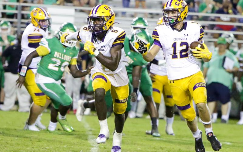 Columbia receiver Camdon Frier (12) rushes up the field as Jaylen Cooper runs to block during Friday’s Preseason Classic against Suwannee. (BRENT KUYKENDALL/Lake City Reporter)