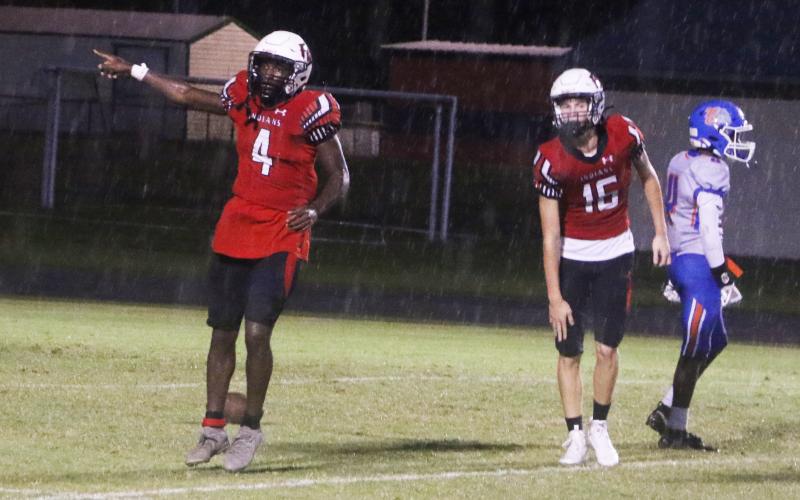 Fort White running back Maliki Clark signals a first down after a long run against Taylor County last Friday. (MORGAN MCMULLEN/Lake City Reporter)
