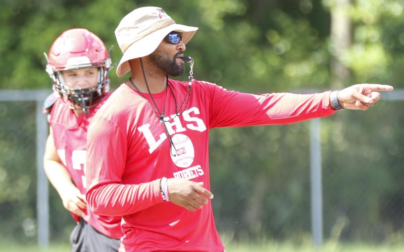 Lafayette head coach Marcus Edwards signals to players during Wednesday’s practice. (JAMIE WACHTER/Lake City Reporter)