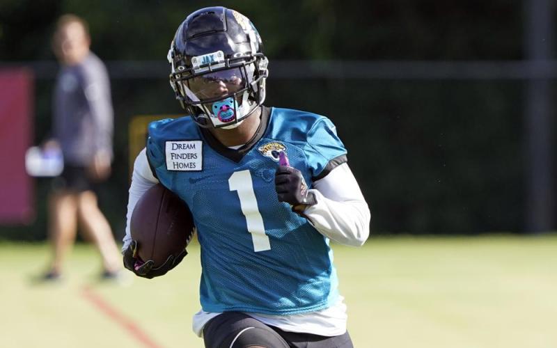 Jacksonville Jaguars running back Travis Etienne runs after a reception during practice on July 26 in Jacksonville. (JOHN RAOUX/Associated Press)