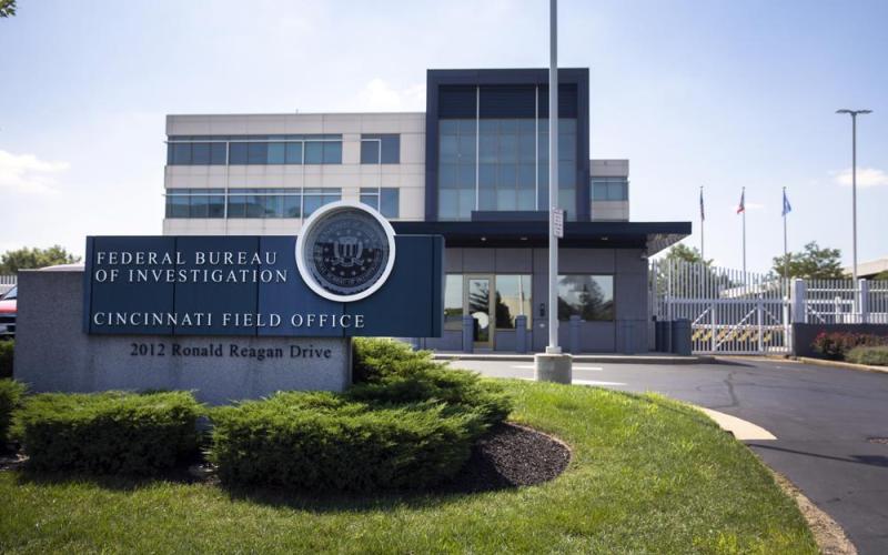 The entrance to the FBI headquarters in Cincinnati is shown. An armed man decked out in body armor tried to breach a security screening area at an FBI field office in Ohio on Thursday, then fled and exchanged gunfire in a standoff with law enforcement, authorities said. (LIZ DUFOUR/The Cincinnati Enquirer via AP)