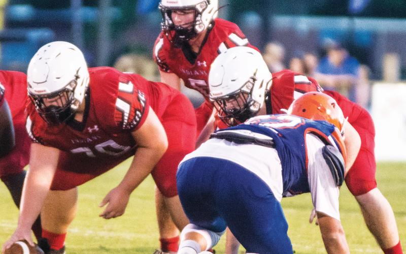Fort White quarterback Clayton Philpot gets set to take a snap during last Friday’s Preseason Classic against Branford. (CHRISTINA FEAGIN/Special to the Reporter)