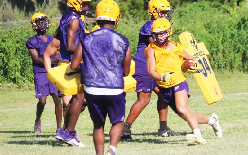 Columbia receiver Camdon Frier runs up the field after a catch during Tuesday’s practice. (JORDAN KROEGER/Lake City Reporter)