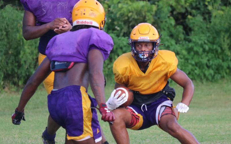 Columbia receiver Dailyn Bradley makes a move in the open field after catching a pass during Friday’s practice. (JORDAN KROEGER/Lake City Reporter)
