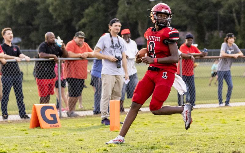 Lafayette quarterback Tywan Williamson scores a touchdown on keeper against Dixie County last Friday. (JACK HOWDESHELL/Special to the Reporter)