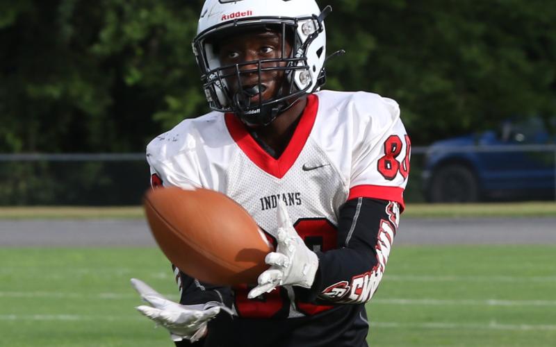 Fort White running back Kamarion Griffin catches a touchdown pass during Friday’s team scrimmage. (MORGAN MCMULLEN/Lake City Reporter)
