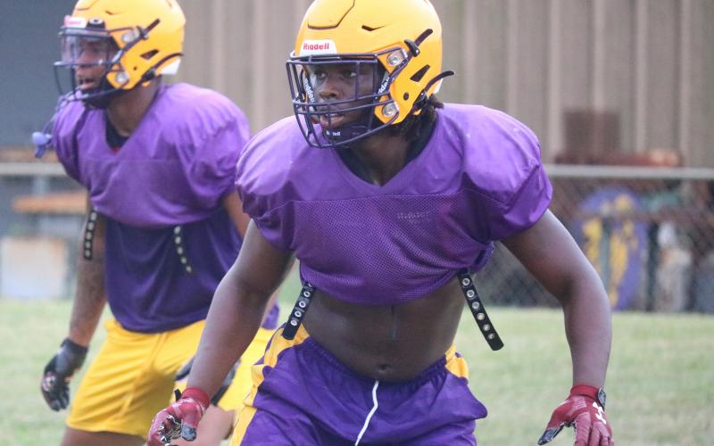 Columbia linebacker Tyrell Peterson gets set for a snap during practice on Aug. 11. (JORDAN KROEGER/Lake City Reporter)