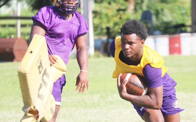 Columbia receiver Tray Tolliver runs after making a catch during Tuesday’s practice. (JORDAN KROEGER/Lake City Reporter)