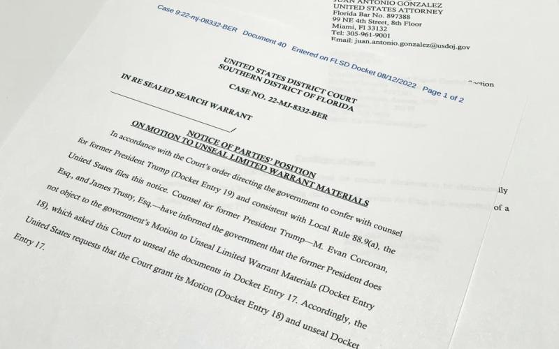 The notice filed by the Justice Department to the U.S. District Court South District of Florida informing the judge that lawyers for former President Donald Trump did not object to the government's motion to unseal the search warrant for Trump's Mar-a-Lago estate, is photographed Friday. (JON ELWICK/Associated Press)