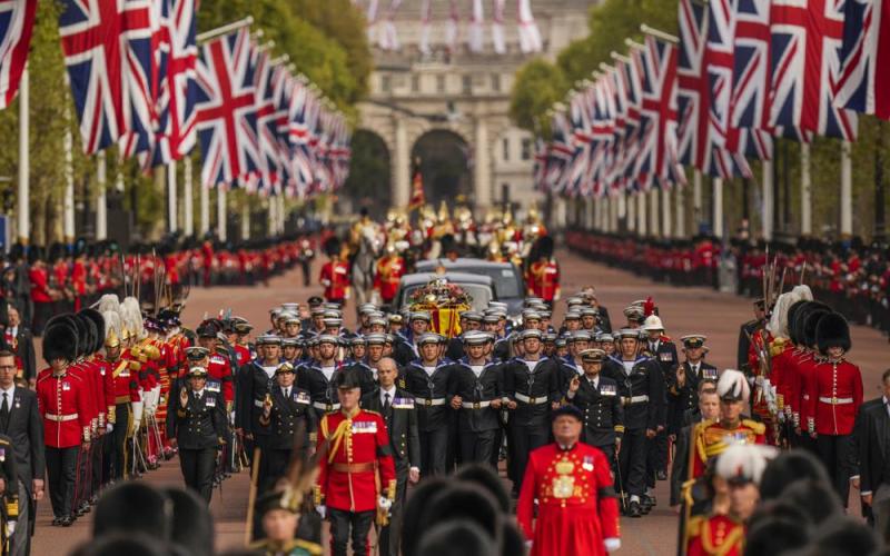 The coffin of Queen Elizabeth II is pulled past Buckingham Palace following her funeral service in Westminster Abbey in central London on Monday. (VADIM GHIRDA/Associated Press)