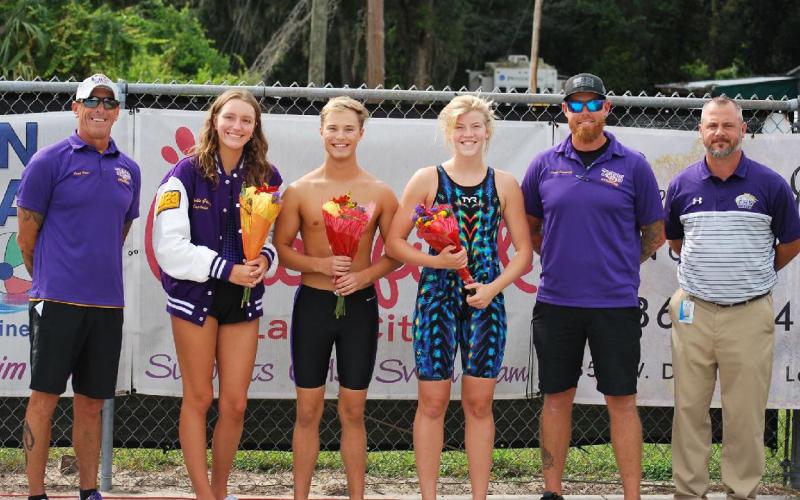 Columbia’s swim team held Senior Night on Tuesday. Pictured are head coach Shawn Rost (from left), Izzy Glenn, Seth Grubb, Abby Schuler, assistant coach Ryan Shoemaker and Columbia Principal Trey Hosford. (COURTESY)