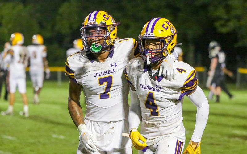 Columbia cornerback Amare Ferrell (7) and receiver Dailyn Bradley (4) celebrate after Bradley’s touchdown catch against Buchholz on Aug. 25. (BRENT KUYKENDALL/Lake City Reporter)