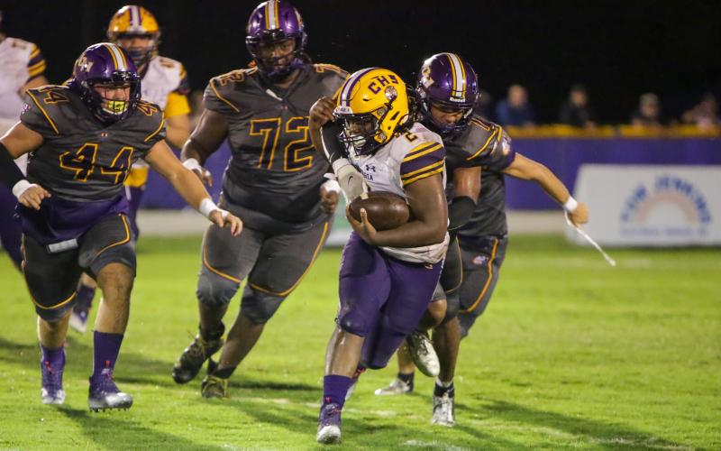 Union County’s defense swarms in to tackle Columbia running back Tony Fulton on Friday night. (BRENT KUYKENDALL/Lake City Reporter)