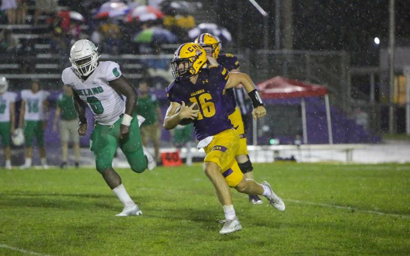 Columbia quarterback Evan Umstead rushes upfield Friday night against DeLand. (BRENT KUYKENDALL/Lake City Reporter)