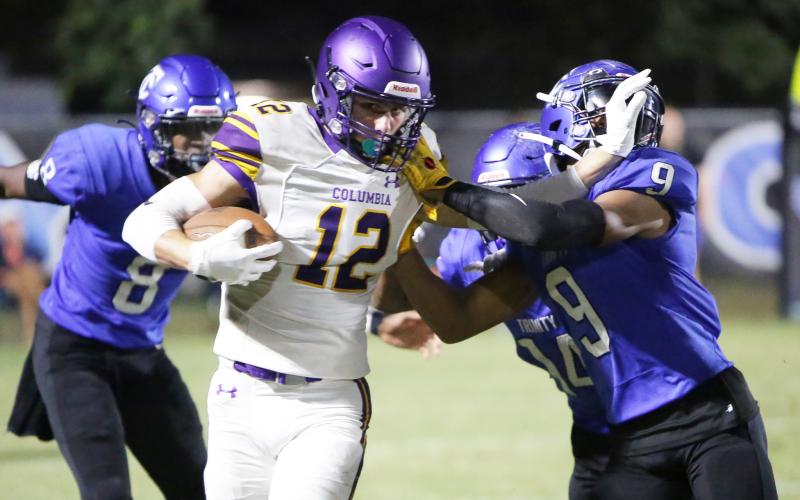 Columbia receiver Camdon Frier fights off Trinity Christian defensive back Kyle Boylston after a reception during Friday’s game. (BRENT KUYKENDALL/Lake City Reporter)