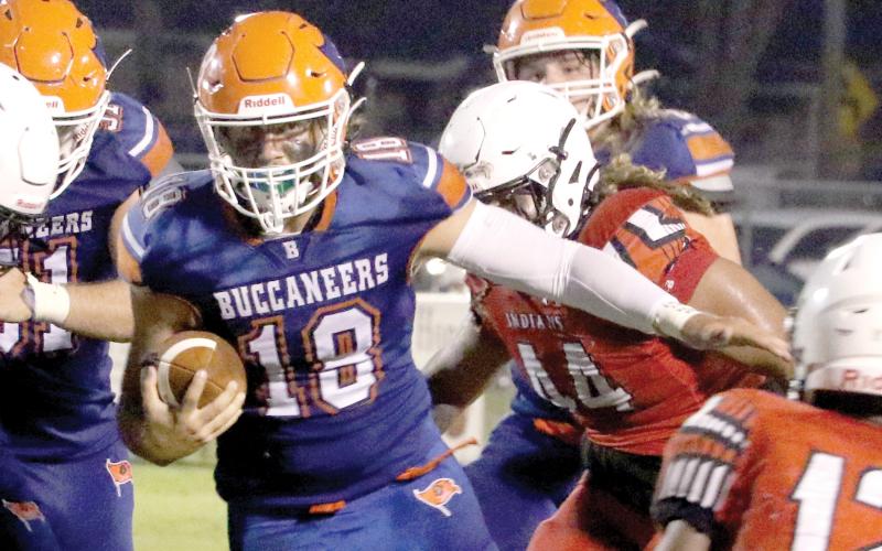Branford quarterback Cohen David looks for room to run against Fort White in a Preseason Classic game Aug. 19. (MORGAN MCMULLEN/Lake City Reporter)