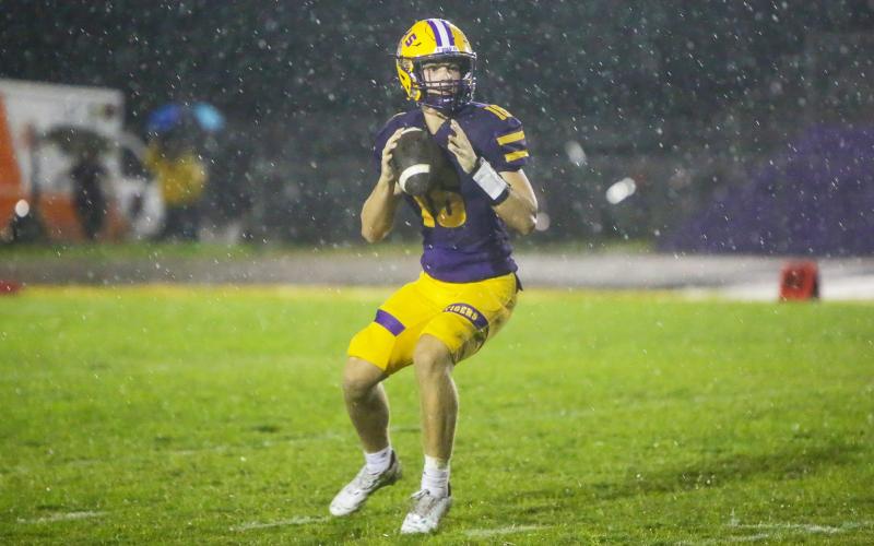 Columbia quarterback Evan Umstead drops back to pass against DeLand on Friday. (BRENT KUYKENDALL/Lake City Reporter)