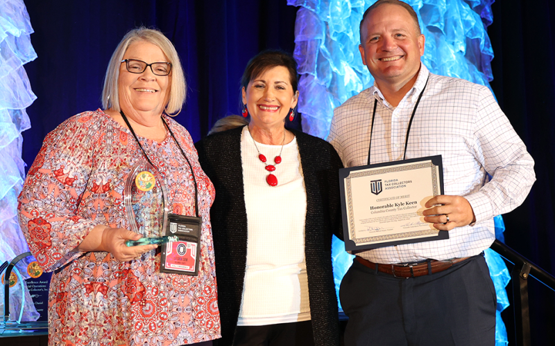 The Columbia County Tax Collector’s office was honored with a 2022 legacy finance award by the Florida Tax Collector’s Association. The award is earned for outstanding finance operations and clean annual audit reports. La Gina Dow, (left) Columbia County Tax Collector Finance Director, and Columbia County Tax Collector Kyle Keen (right) accepted the honors from Florida Tax Collector’s Association President Rhonda Skipper during a recent state event. (COURTESY)