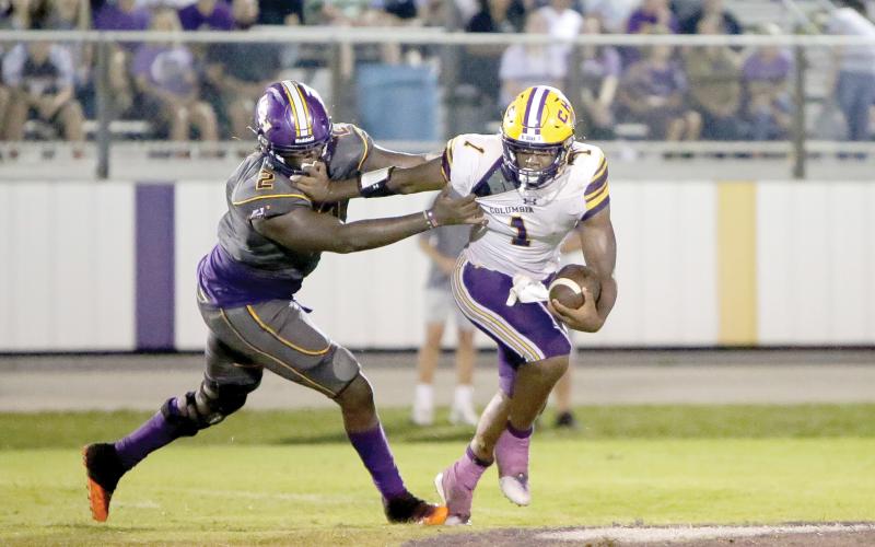 Columbia quarterback Tyler Jefferson, trying to avoid a Union County defender last Friday, will try to deliver the Tigers their first win of the season Friday when Deland visits. (BRENT KUYKENDALL/Lake City Reporter)