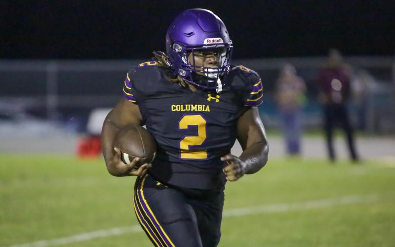 Columbia running back Tony Fulton rushes up the field against Madison County on Friday. (BRENT KUYKENDALL/Lake City Reporter)