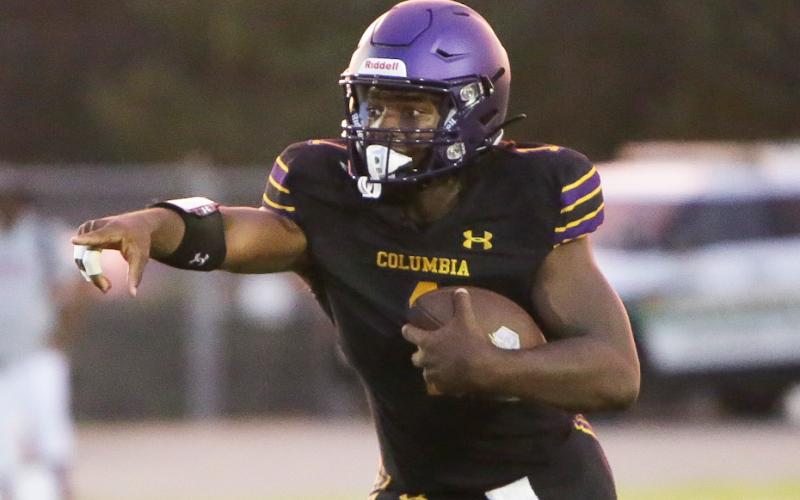 Columbia quarterback Tyler Jefferson scrambles up the field against Madison County last Friday. (BRENT KUYKENDALL/Lake City Reporter)