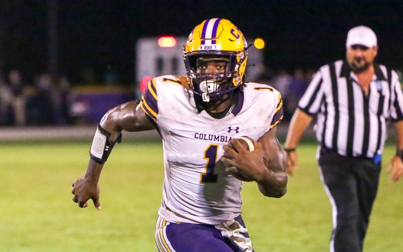 Columbia quarterback Tyler Jefferson scrambles up the field against Union County on Friday. (BRENT KUYKENDALL/Lake City Reporter)