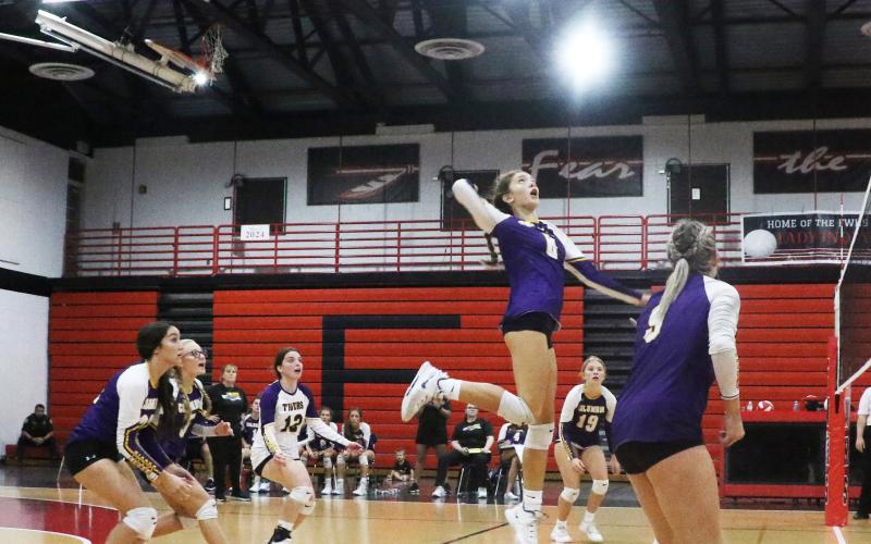 Columbia’s Sinei Wood rises to slam a shot against Fort White on Thursday. (MORGAN MCMULLEN/Lake City Reporter)